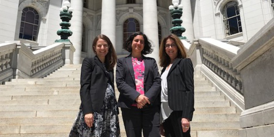 Karen Lindell, Jessica Feierman, Marsha Levick standing on court steps.