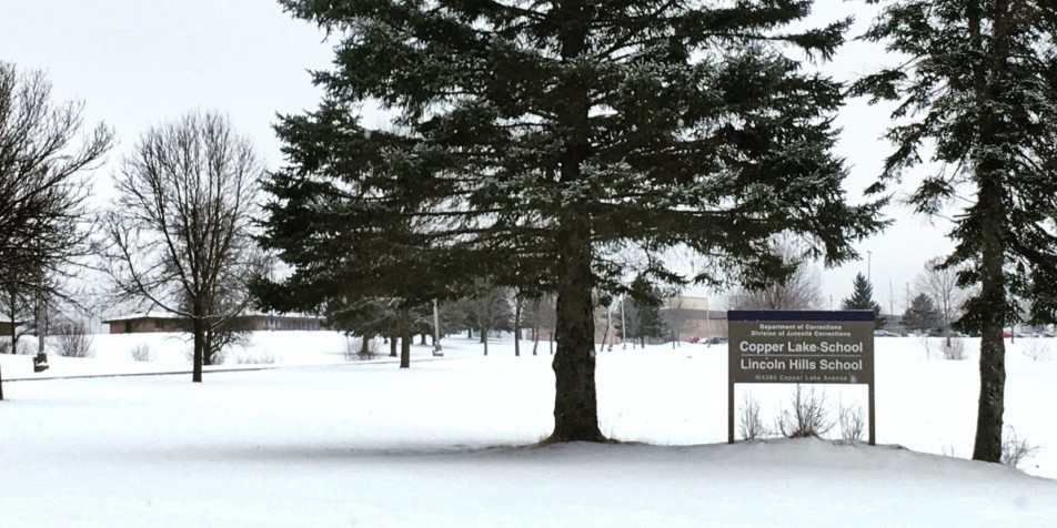 Photo of trees and sign outside Lincoln Hills Juvenile Correctional Facility.