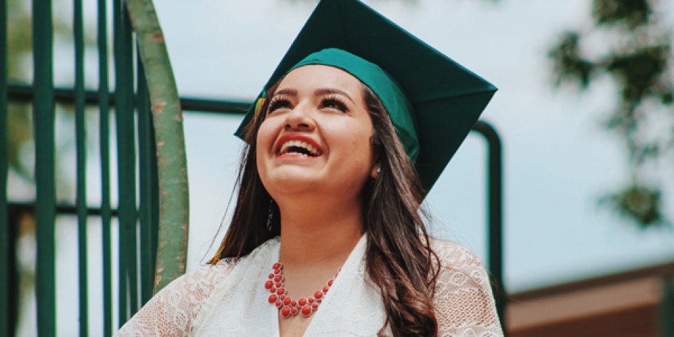 Young woman in graduation cap.