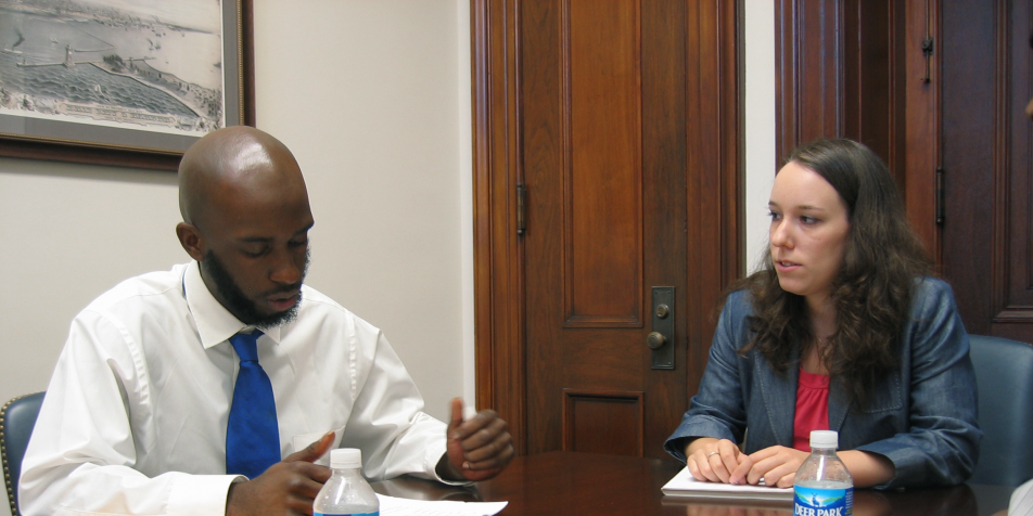 Youth advocate speaking with senate staffer.