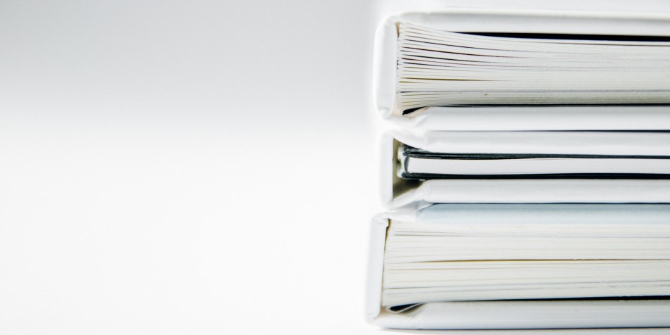 stack of white binders 