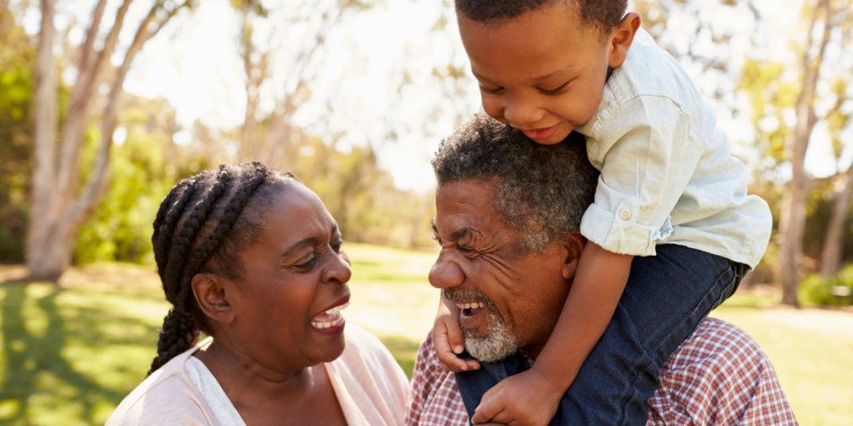 grandparents laughing with grandchild