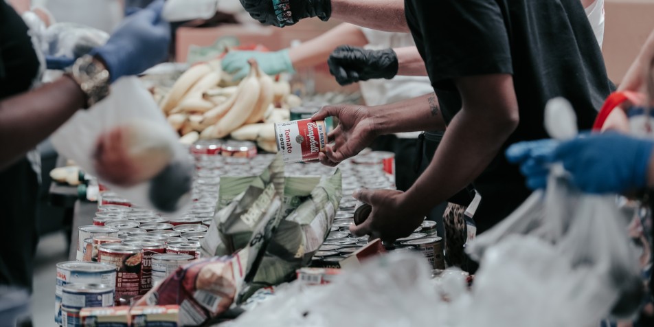 Hands of youth serving food