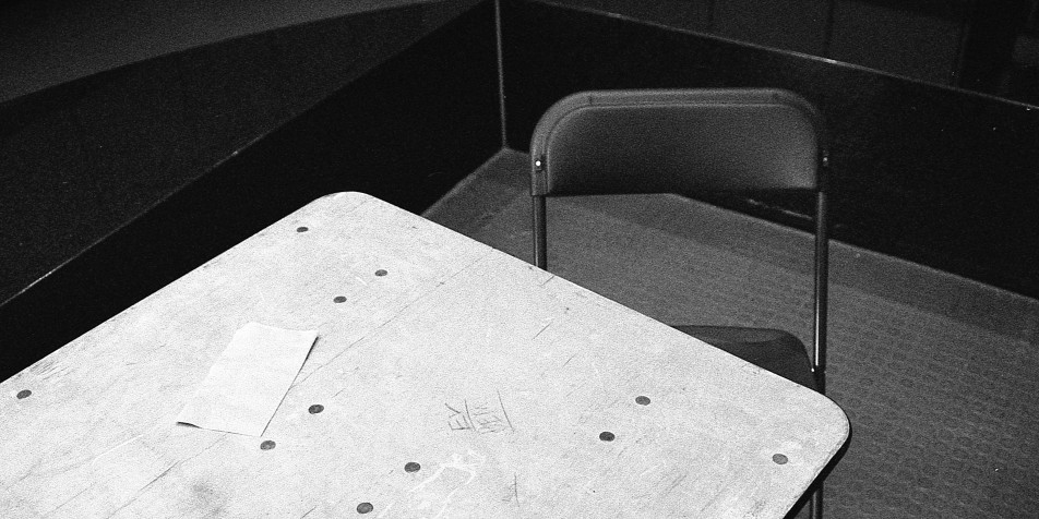 table and chair in a dimly lit room