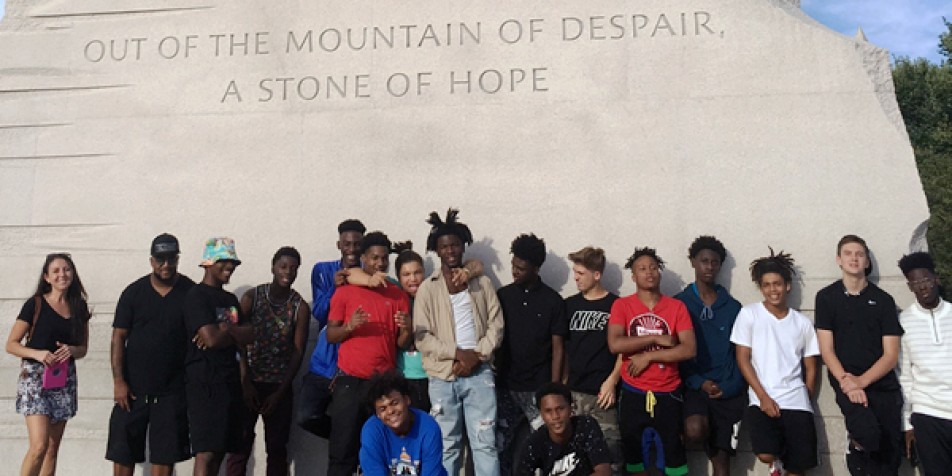 Group of students standing in front of MLK monument in Washington, DC.