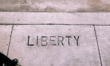 liberty etched into the sidewalk